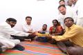 Telangana MA&UD Minister KT Rama Rao visits fluorosis victim in Nalgonda on Thursday. (Photo credit: Twitter/@KTRTRS) - Sakshi Post