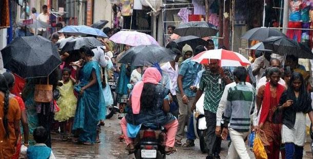 Rain dampens holiday mood - Sakshi Post