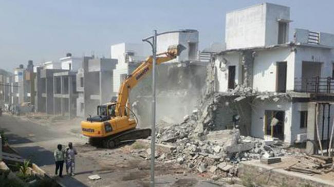 HMDA officials demolish villas at SRK Green Park at Bowrampet on Monday - Sakshi Post