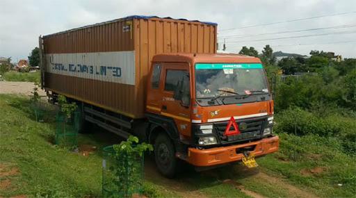 The container truck that was robbed of cigarette stocks worth Rs 4 crore on the outskirts of Hyderabad on Saturday. - Sakshi Post