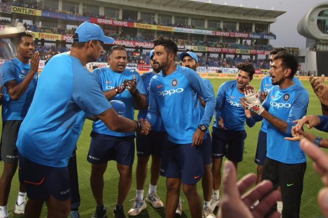 erabad pacer Mohammed Siraj being welcomed by teammates at Rajkot, on Satur - Sakshi Post