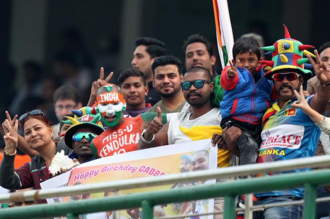 Cricket fans at the third and final Test at the Ferozeshah Kotla, on Tuesday. - Sakshi Post