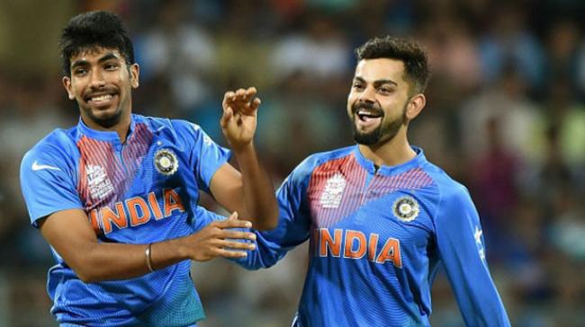 Bowler Jasprit Bumrah and captain Virat Kohli &amp;lt;br&amp;gt; - Sakshi Post