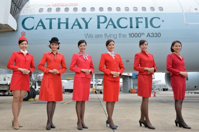 Hong Kong flag carrier Cathay Pacific has decided to end its skirts-only rule for female staff members after intense union pressure - Sakshi Post